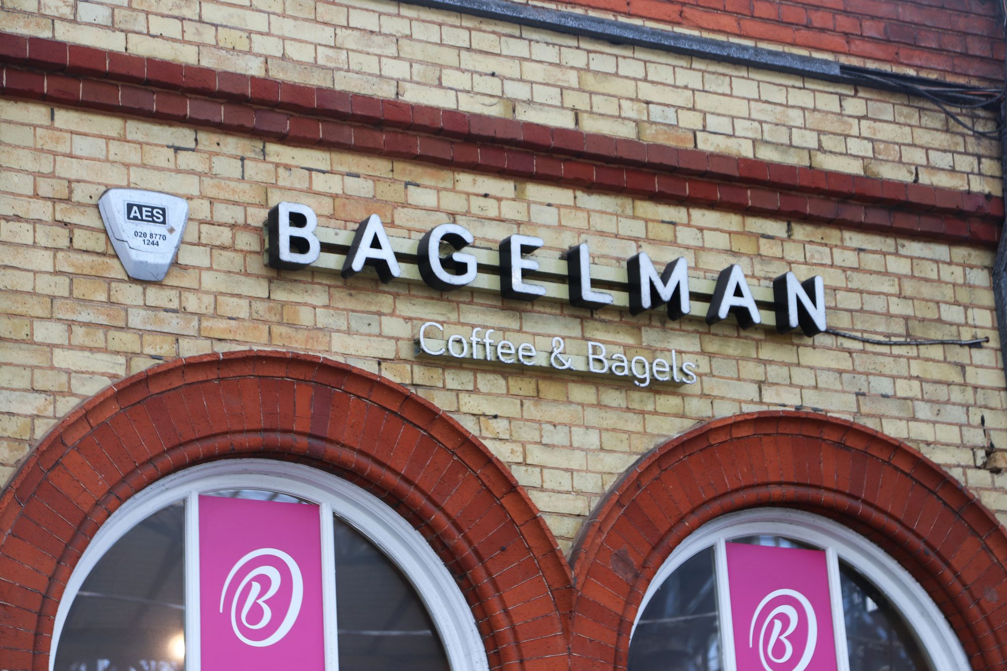 The outside of Bagelman showing the sign 'Bagelman coffee and bagels'