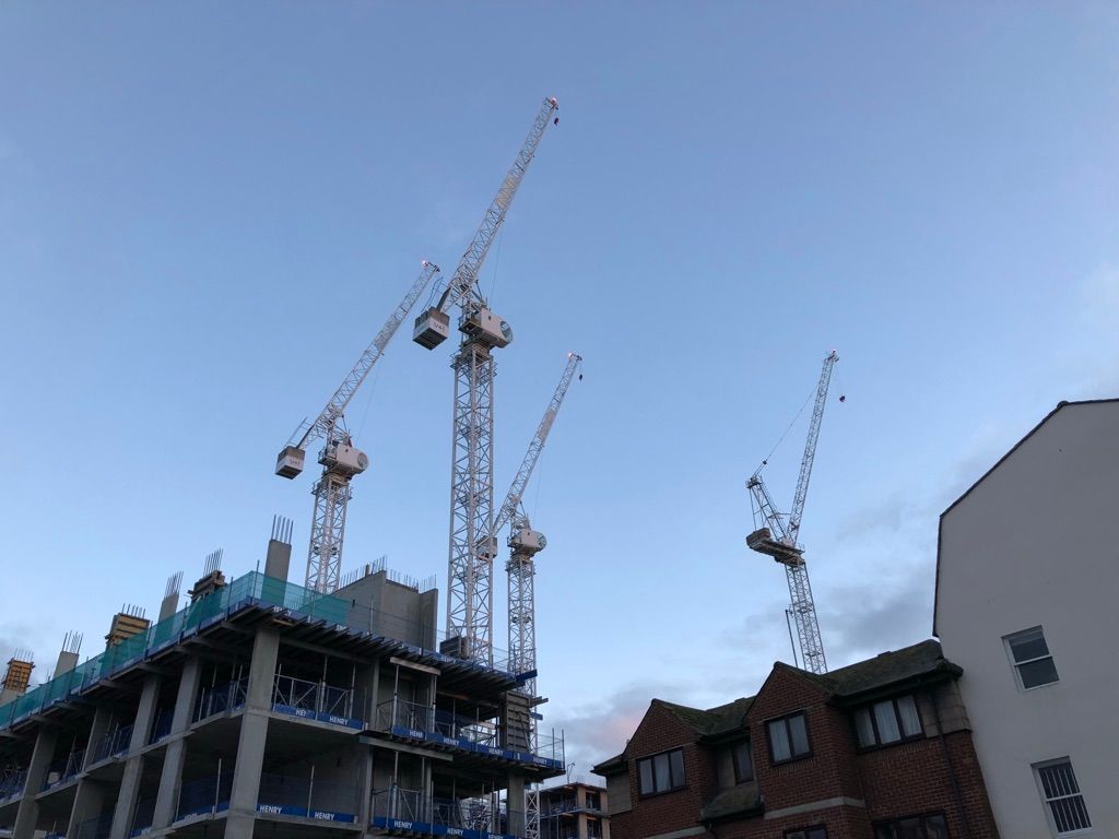 A picture of cranes above a construction site.