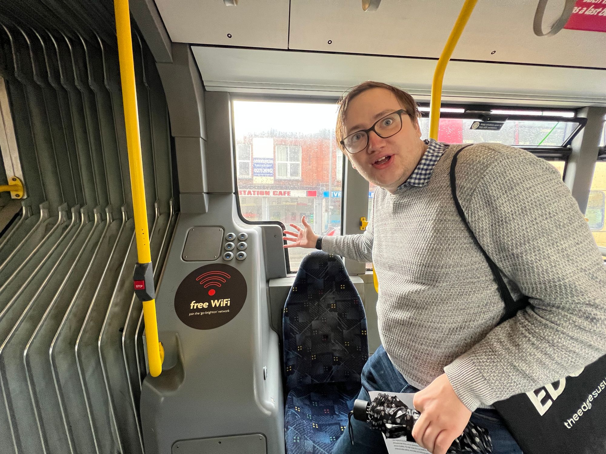 Concerned local resident Xavier Voigt-Hill gestures towards his favourite bendy bus seat, the solo sideways one with 12 USB ports