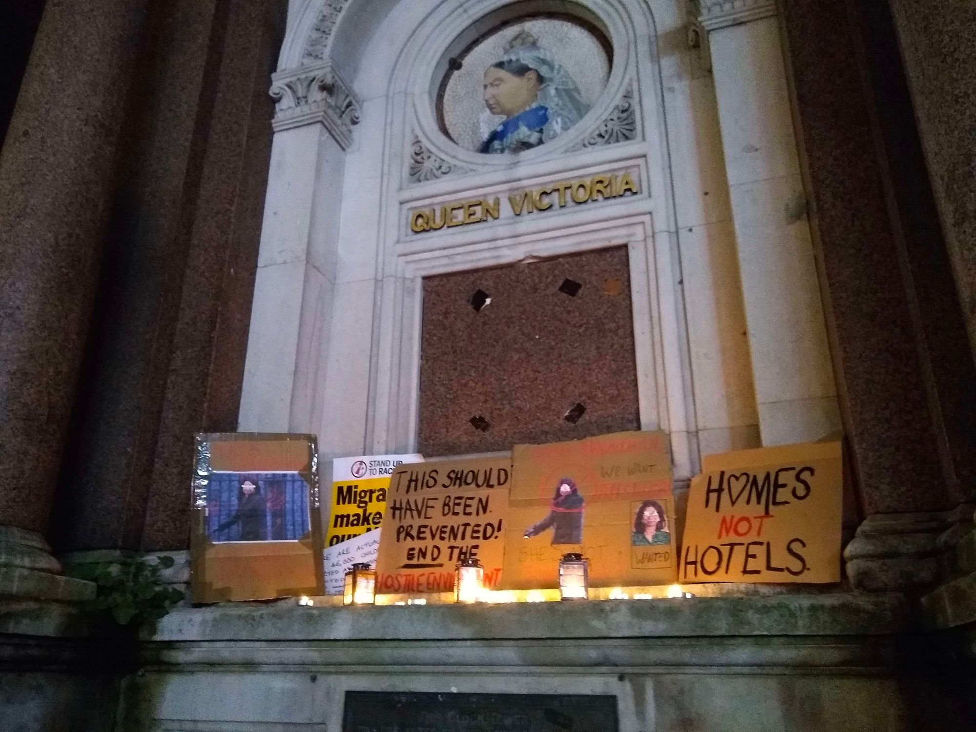 Picture of protest signs under the clock tower
