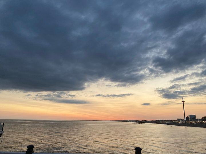 Picture of the sea and coastline of Brighton taken from the Pier.