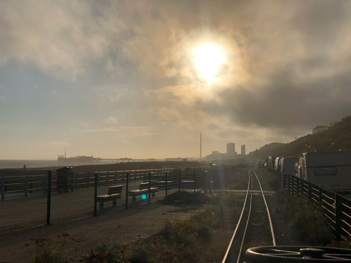 A picture of the view down the Volks track from Marina station with a cloudy haze obscuring the sun