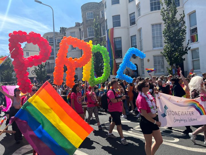 Picture of multicoloured balloons spelling out "PRIDE" as part of the Pride parade