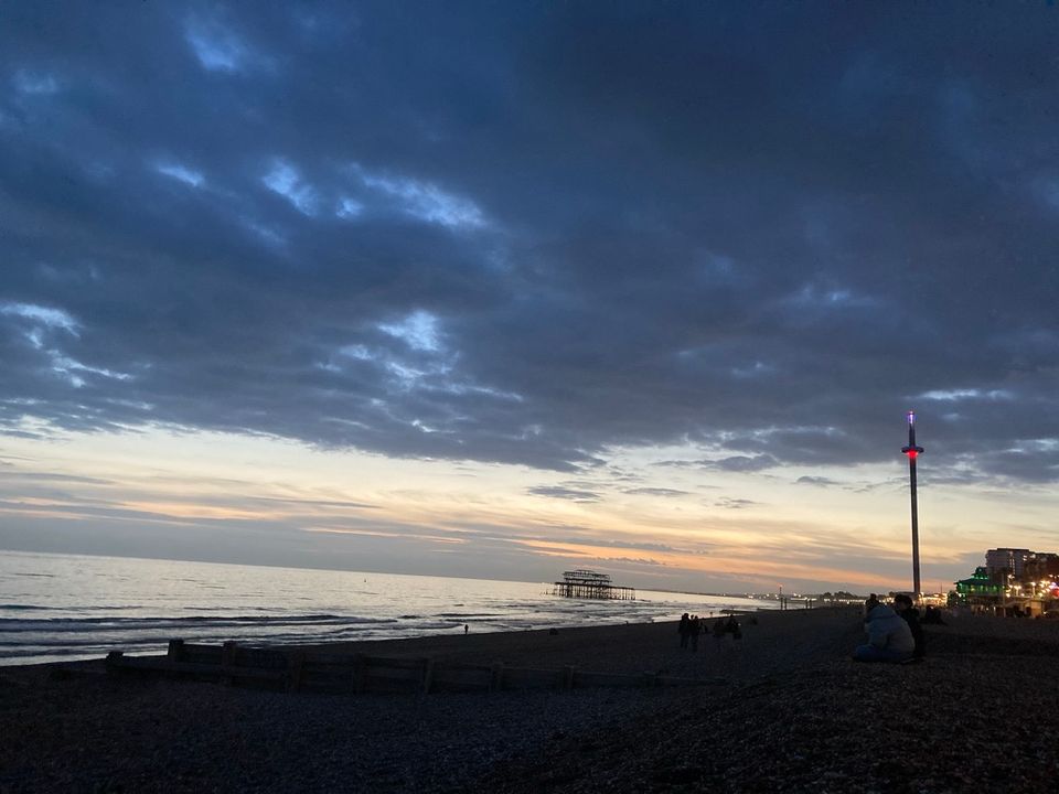 The beach facing West Pier and the i360 at sunset