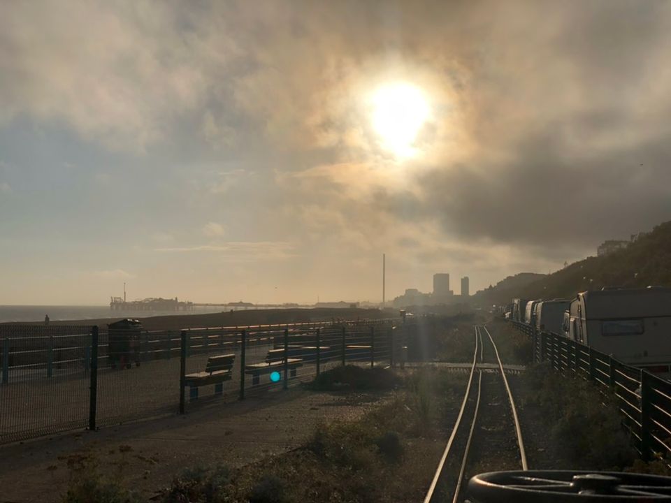 A picture of the view down the Volks track from Marina station with a cloudy haze obscuring the sun