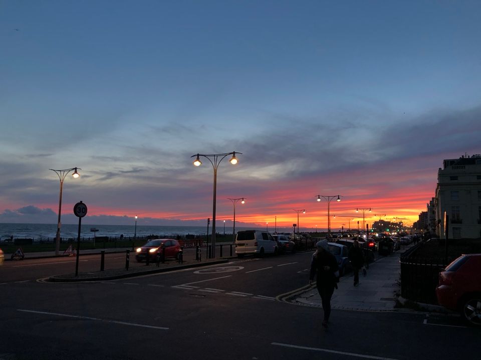 A picture of the sun setting over Hove Lawns