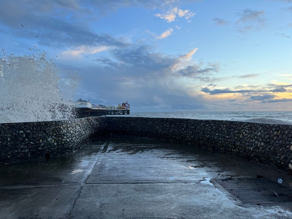 Picture of sea spray crashing over the groyne by Brighton Pier